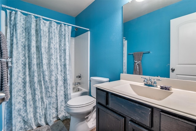 full bathroom with shower / tub combo, vanity, and toilet