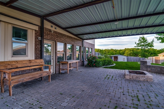 view of patio / terrace featuring an outdoor fire pit