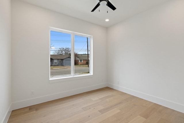 unfurnished room featuring ceiling fan and light hardwood / wood-style floors