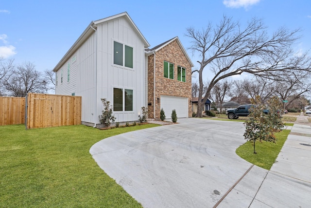 view of front facade featuring a garage and a front lawn