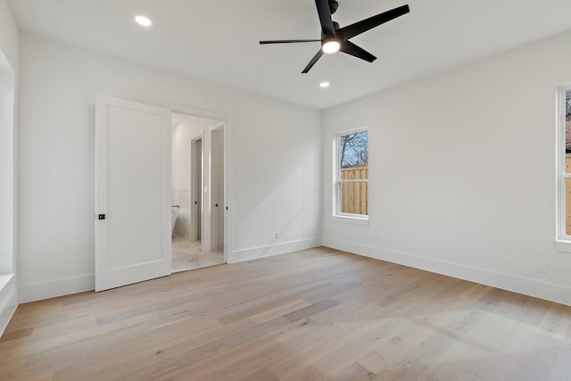 unfurnished room featuring ceiling fan and light hardwood / wood-style flooring