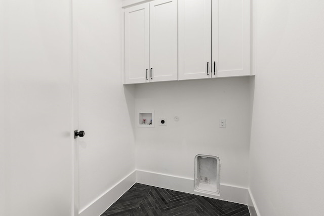 clothes washing area with washer hookup, cabinets, gas dryer hookup, and hookup for an electric dryer