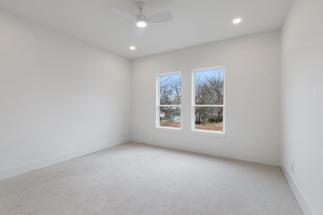 spare room with ceiling fan and carpet flooring