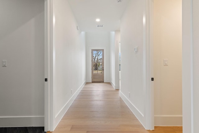 corridor featuring light hardwood / wood-style floors