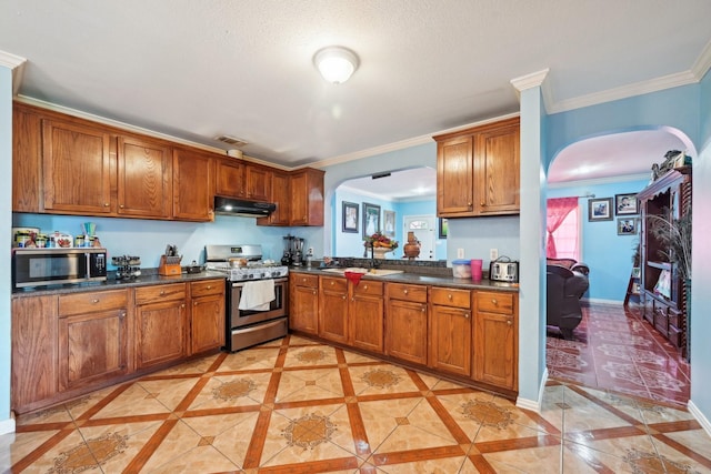 kitchen with light tile patterned floors, appliances with stainless steel finishes, ornamental molding, and sink