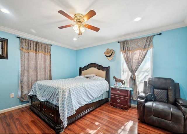 bedroom with ceiling fan, hardwood / wood-style floors, and crown molding