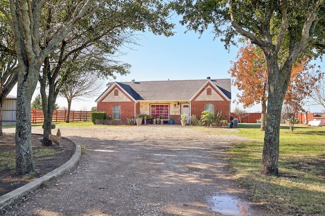 ranch-style home with a front yard