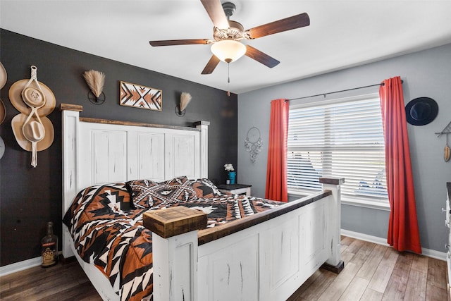 bedroom featuring ceiling fan and dark wood-type flooring