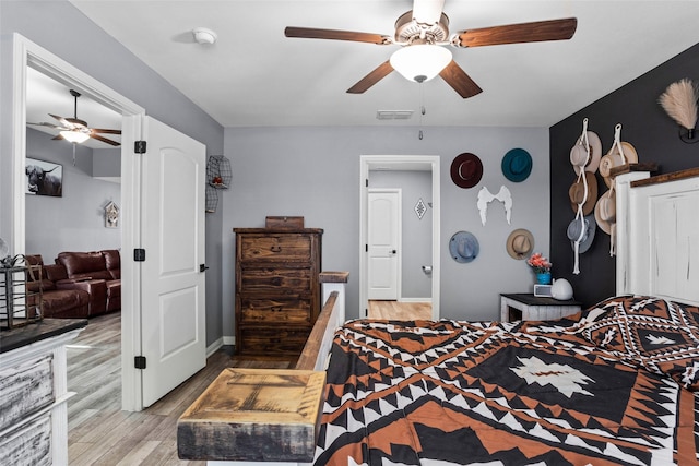 bedroom featuring ceiling fan and light hardwood / wood-style flooring