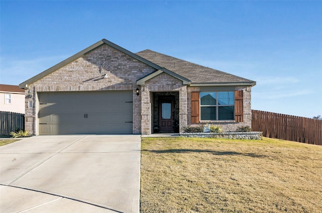 view of front of home featuring a front lawn and a garage