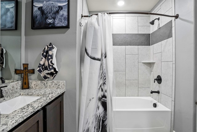 bathroom featuring vanity and shower / bath combo