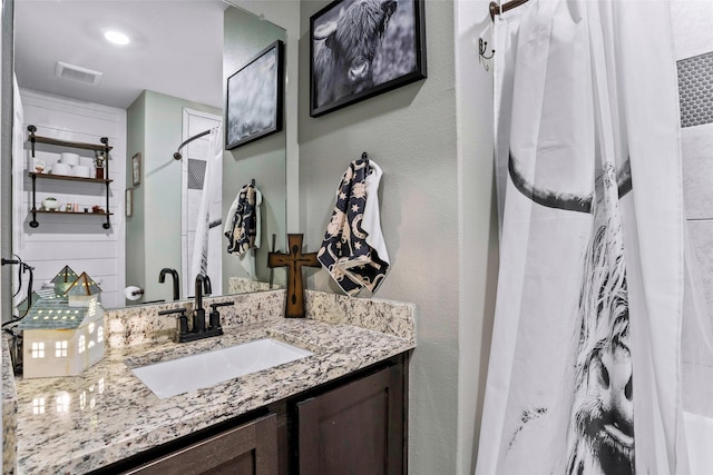 bathroom with vanity and a shower with curtain