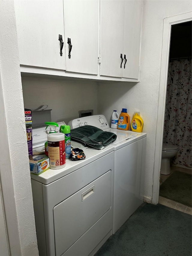 clothes washing area with washing machine and clothes dryer