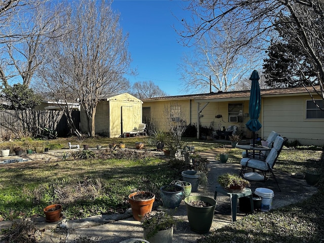 rear view of house featuring a storage unit