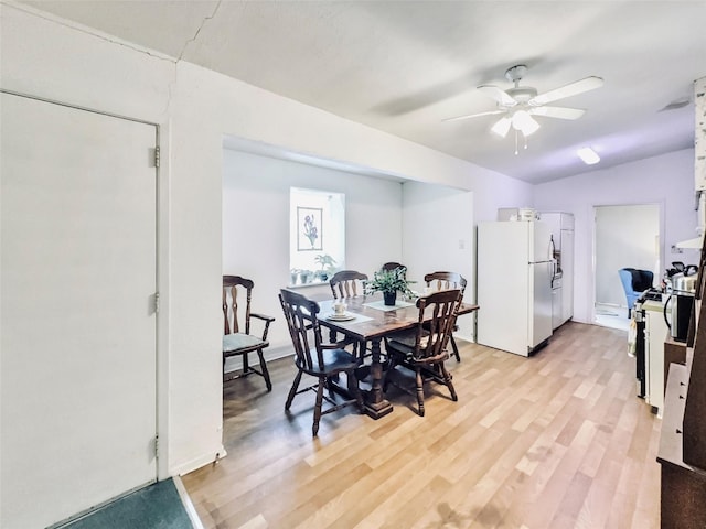 dining space featuring ceiling fan and light hardwood / wood-style floors