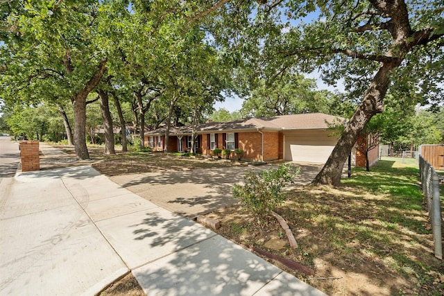 single story home featuring a garage