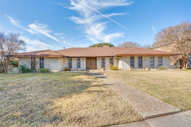 ranch-style house with a front lawn