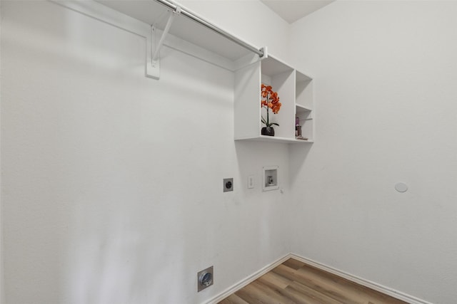 clothes washing area with hookup for a washing machine, electric dryer hookup, and hardwood / wood-style floors