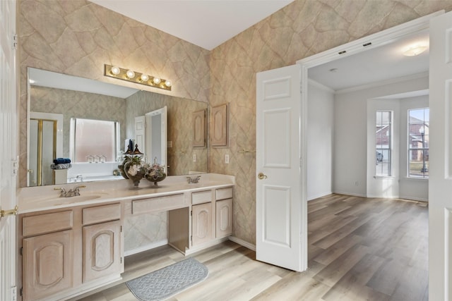 bathroom with vanity, hardwood / wood-style flooring, and ornamental molding