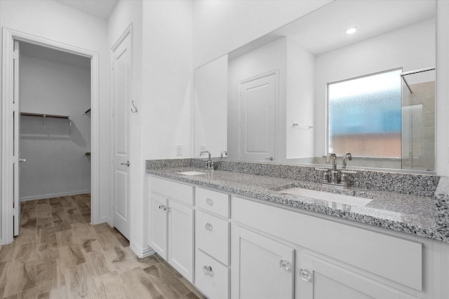 bathroom with vanity and hardwood / wood-style floors