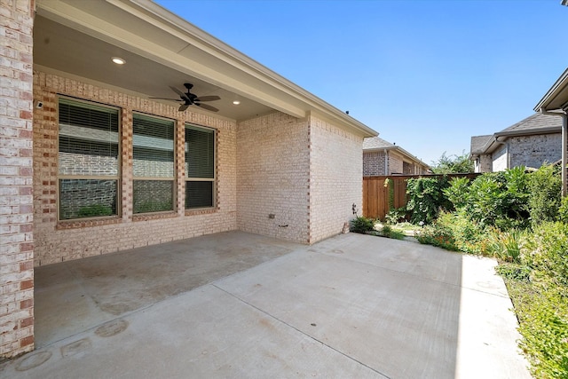 view of patio featuring ceiling fan