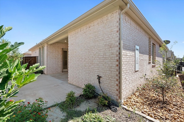 view of side of home featuring a patio