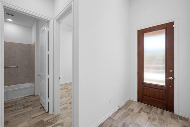 entryway with light hardwood / wood-style flooring