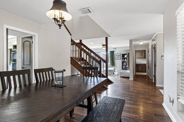 dining room featuring ceiling fan and dark hardwood / wood-style flooring