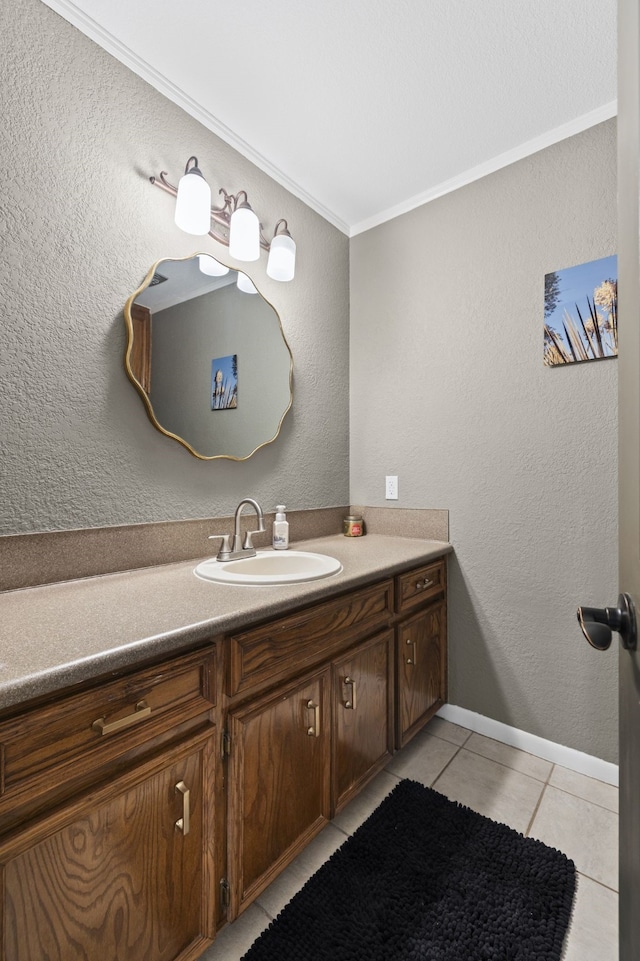 bathroom with tile patterned flooring, vanity, and crown molding