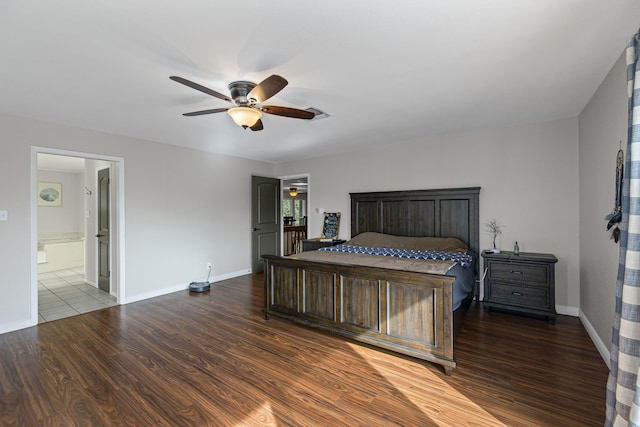 bedroom featuring hardwood / wood-style floors, ensuite bath, and ceiling fan