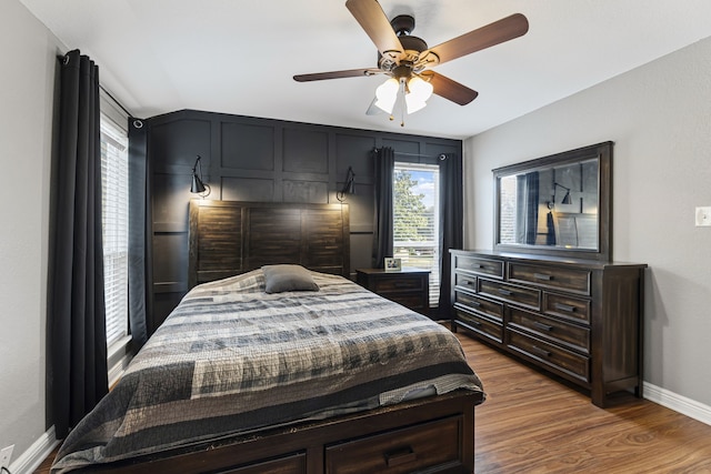 bedroom with wood-type flooring and ceiling fan