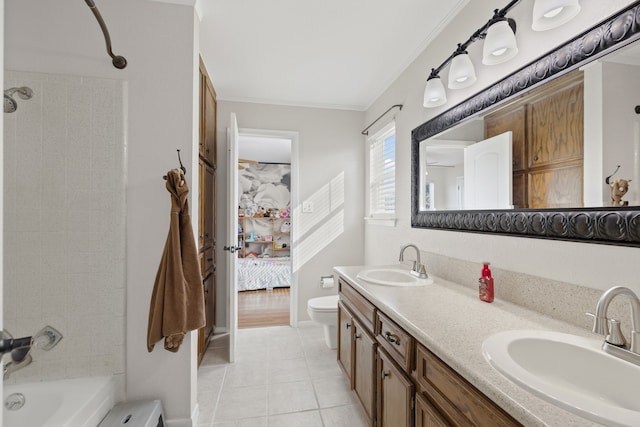 ensuite bathroom with crown molding, tile patterned flooring, a sink, and connected bathroom