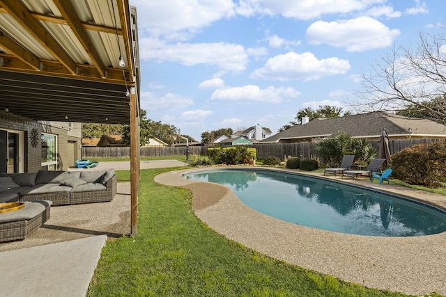 view of swimming pool with a fenced in pool, a fenced backyard, an outdoor hangout area, a yard, and a patio area