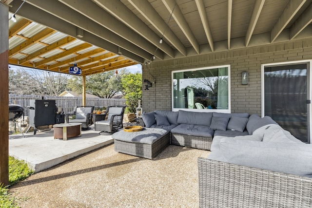 view of patio / terrace with outdoor lounge area and fence