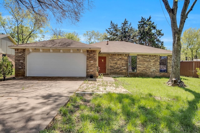 single story home featuring a front lawn and a garage