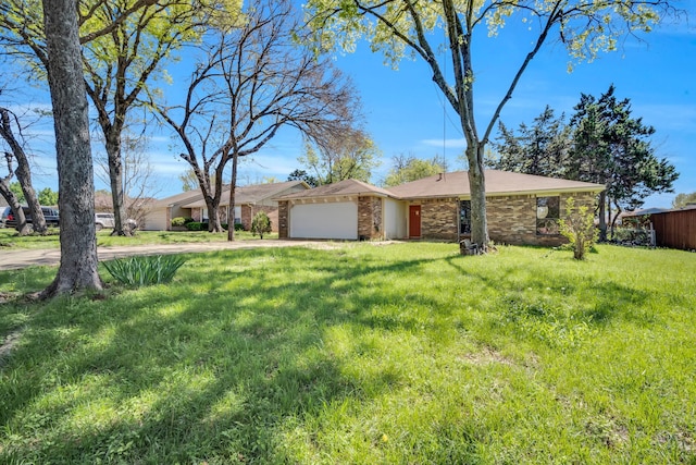 ranch-style home featuring a front yard and a garage