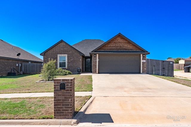 view of front facade with a garage and a front yard