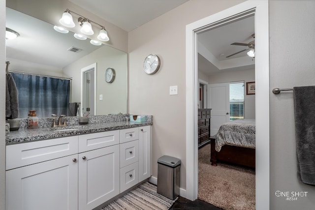 bathroom with ceiling fan and vanity