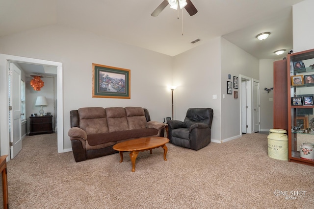 carpeted living room with vaulted ceiling and ceiling fan