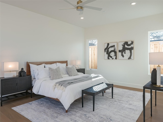 bedroom featuring dark hardwood / wood-style floors and ceiling fan