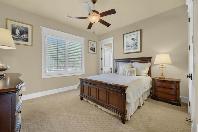 bedroom with ceiling fan and light colored carpet