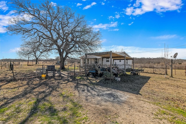 view of yard with a rural view