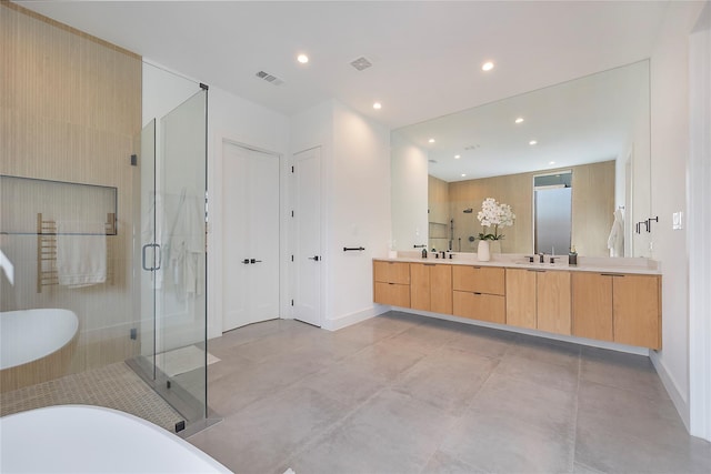 bathroom featuring vanity and shower with separate bathtub