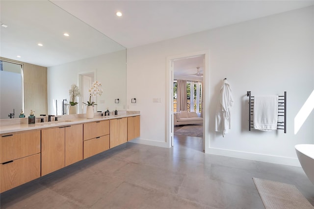 bathroom featuring concrete flooring and vanity