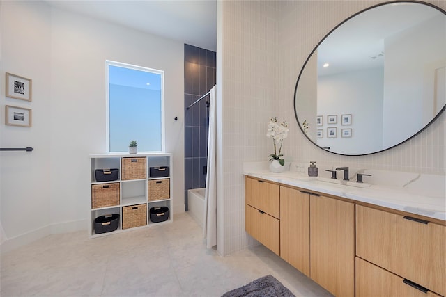 bathroom featuring tasteful backsplash, bathtub / shower combination, and vanity