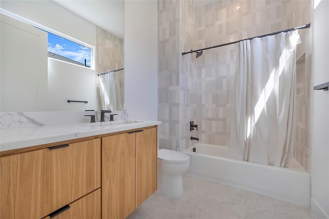 full bathroom featuring toilet, vanity, and shower / tub combo