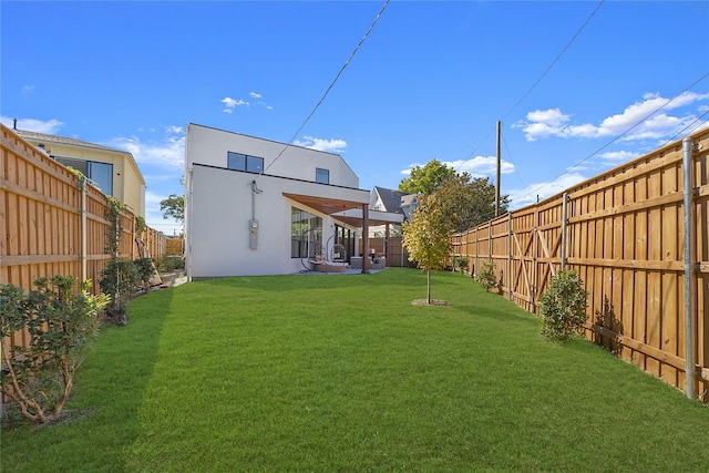 back of house featuring a lawn