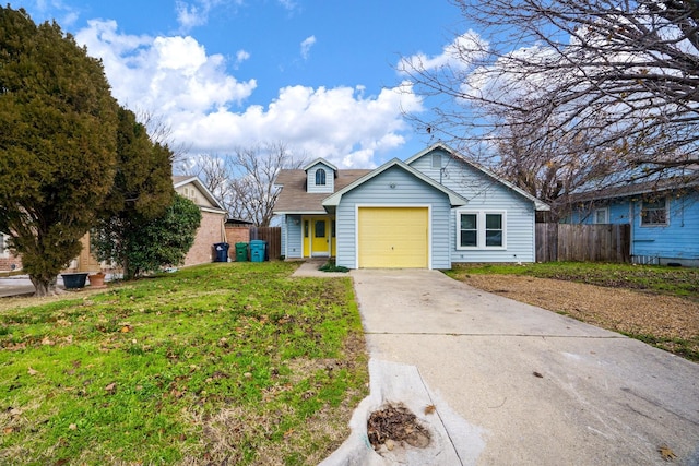 view of front of property featuring a front lawn and a garage