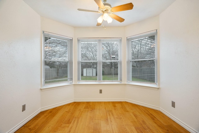 unfurnished room featuring ceiling fan and light wood-type flooring