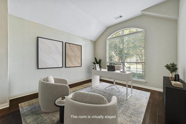 bedroom with light carpet, connected bathroom, lofted ceiling, and ceiling fan